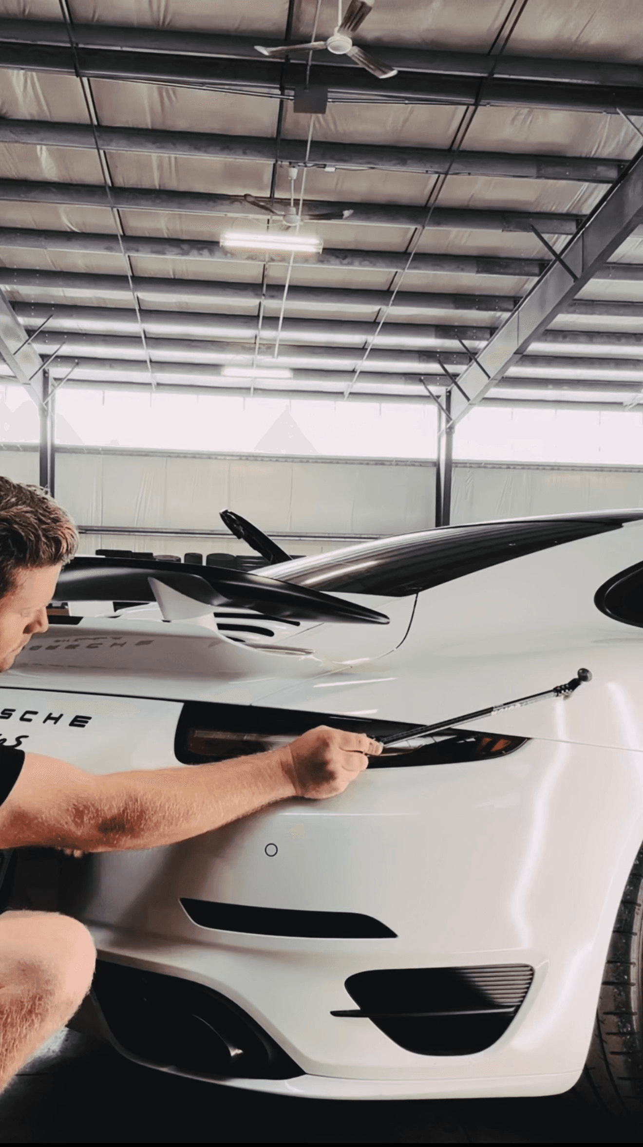 Technician performing paintless dent repair